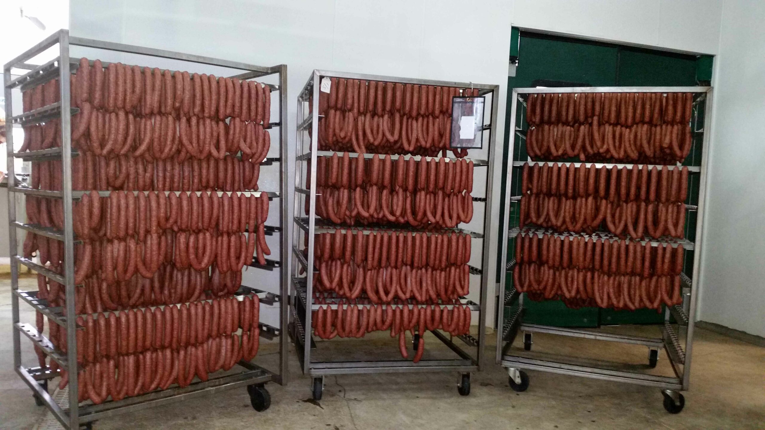 Racks of sausage at Century Oak Packing Co